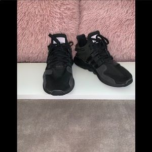 All black Adidas shoes